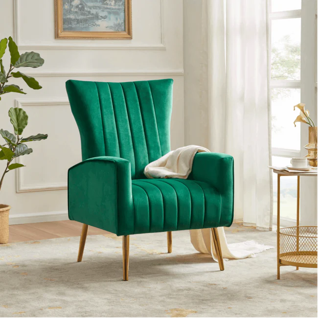 Green Turkish wing chair with vibrant fabric, gold metal legs, and a plush design, perfect for modern interiors.