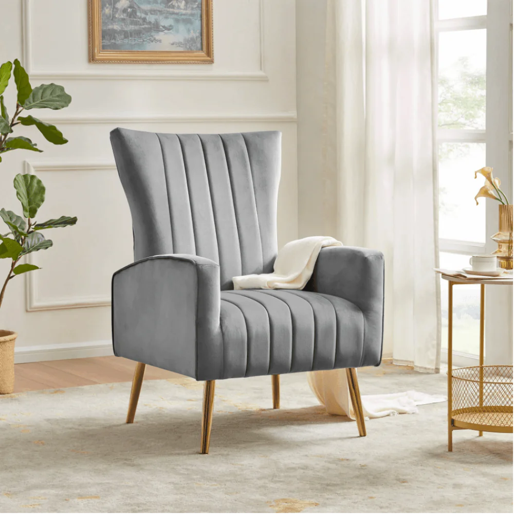 Grey Turkish wing chair with sleek fabric, sturdy gold legs, and a timeless design, blending style and functionality.
